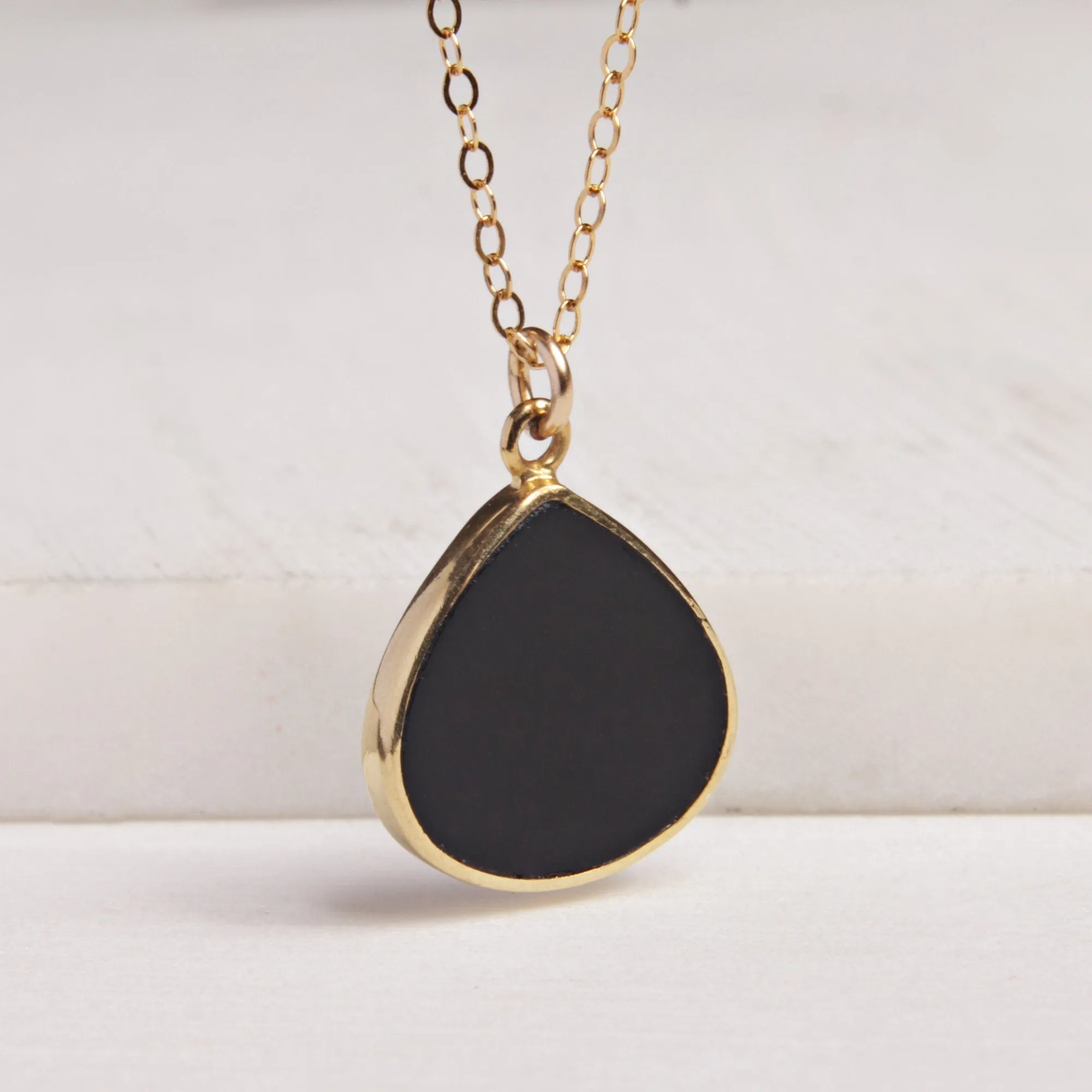 Black onyx gold drop necklace